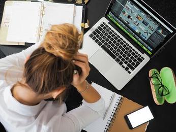 stressed out woman at computer